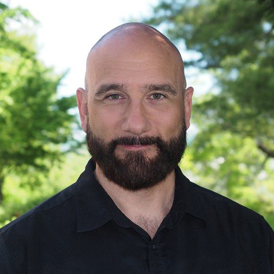 Formal headshot of Dr. Matthew Komelski