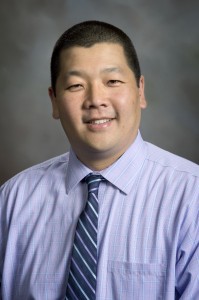 Formal headshot of Dr. Takumi Sato