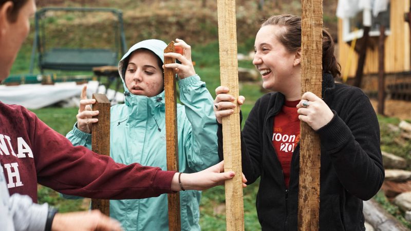 Students with lumber on a VT Engage trip