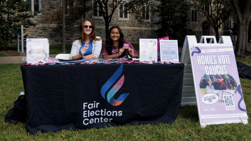 Two students tabling a Hokies Vote event